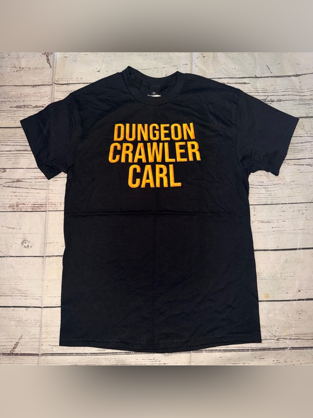 Ripple Junction Dungeon Crawler Carl Tee - Black with Gold Print